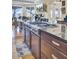 Spacious kitchen island with stainless steel cooktop, granite countertop, and dining area at 1739 Indigo Island Dr, Hanahan, SC 29410