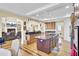 Open kitchen with large island, stainless steel refrigerator, and cabinetry for lots of storage at 1739 Indigo Island Dr, Hanahan, SC 29410