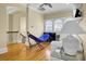Bright living area with hardwood floors, complemented by a hammock, couch, and abundant natural light at 1739 Indigo Island Dr, Hanahan, SC 29410