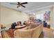 Cozy living room featuring neutral colors, a ceiling fan, and a decorative rug at 1739 Indigo Island Dr, Hanahan, SC 29410