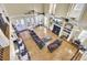 Spacious living room featuring a high ceiling, fireplace, large sofa and hardwood floors at 1739 Indigo Island Dr, Hanahan, SC 29410