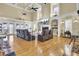 Bright and airy living room with a vaulted ceiling, fireplace, and expansive hardwood flooring at 1739 Indigo Island Dr, Hanahan, SC 29410