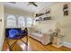 Comfortable living space with a sofa, hammock, shelving, and windows for natural light at 1739 Indigo Island Dr, Hanahan, SC 29410