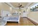 Comfortable main bedroom with tray ceilings, hardwood floors, and a sitting area at 1739 Indigo Island Dr, Hanahan, SC 29410