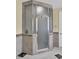 A tiled shower with a glass door features a convenient towel rack for an organized and accessible bathroom at 1739 Indigo Island Dr, Hanahan, SC 29410