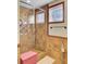 A tiled shower stall with decorative accents, including a window that provides natural light, offering a refreshing bathing experience at 1739 Indigo Island Dr, Hanahan, SC 29410