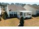Aerial view shows the home's backyard featuring a covered pergola and well-maintained landscaping at 192 Sea Lavender Ln, Summerville, SC 29486