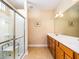 Clean bathroom featuring double sinks, wood cabinets, and a walk-in shower at 192 Sea Lavender Ln, Summerville, SC 29486