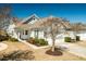 Quaint one-story house featuring a well-manicured lawn, attached garage, and charming curb appeal at 192 Sea Lavender Ln, Summerville, SC 29486