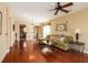 Spacious living room with hardwood floors, ceiling fan, and ample natural light at 192 Sea Lavender Ln, Summerville, SC 29486