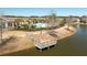Scenic view of a pond with a wooden dock, enhancing the appeal of the community at 192 Sea Lavender Ln, Summerville, SC 29486