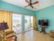Cozy sunroom with sliding glass doors opening to a patio with beautiful lake views at 192 Sea Lavender Ln, Summerville, SC 29486