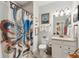 Cozy bathroom with a granite vanity, patterned shower curtain, and decorative fish art at 1930 Carolina Towne Ct, Mount Pleasant, SC 29464