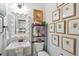 Bright bathroom with a unique mirror, pedestal sink, and an artful gallery wall at 1930 Carolina Towne Ct, Mount Pleasant, SC 29464
