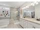 Bright bathroom with a glass enclosed shower, soaking tub, and double vanity with a granite countertop at 1930 Carolina Towne Ct, Mount Pleasant, SC 29464