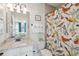 Bathroom featuring a granite vanity, a patterned shower curtain and an open doorway leading to the bedroom at 1930 Carolina Towne Ct, Mount Pleasant, SC 29464