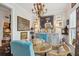 Bright dining room featuring a glass-top table, unique chandelier, and artistic decor at 1930 Carolina Towne Ct, Mount Pleasant, SC 29464