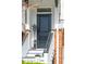 Close-up of front door and stairs with brick details and black door at 1930 Carolina Towne Ct, Mount Pleasant, SC 29464