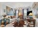 Inviting living room with a cozy sofa, decorative artwork, and plenty of natural light at 1930 Carolina Towne Ct, Mount Pleasant, SC 29464