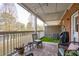 Relaxing covered patio with stylish wicker furniture and a view of the community pond at 1930 Carolina Towne Ct, Mount Pleasant, SC 29464