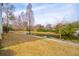 Picturesque pond featuring a fountain surrounded by manicured lawn and trees at 1930 Carolina Towne Ct, Mount Pleasant, SC 29464