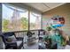 Relaxing screened porch with comfortable seating and views of the surrounding greenery at 1930 Carolina Towne Ct, Mount Pleasant, SC 29464