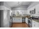 Well-lit kitchen featuring stainless steel appliances and granite countertops at 1975 Trimbleston Pl, Mount Pleasant, SC 29464