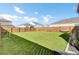 Spacious backyard with artificial turf, wood fence and green soccer goal at 202 N Light Way, Summerville, SC 29486