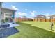 Large backyard featuring lush artificial turf and privacy fence at 202 N Light Way, Summerville, SC 29486