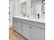 Modern bathroom featuring double sink vanity, sleek fixtures, and a glass-enclosed shower at 202 N Light Way, Summerville, SC 29486