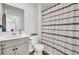 Modern bathroom featuring a decorative shower curtain and updated vanity at 202 N Light Way, Summerville, SC 29486