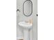 Bathroom features a white pedestal sink, an oval mirror, and black fixtures at 202 N Light Way, Summerville, SC 29486