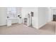 Bright bedroom featuring modern white desk, sleek shelving and neutral carpet at 202 N Light Way, Summerville, SC 29486