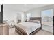 Sunlit bedroom showcasing a comfortable bed and adjacent desk area for work or study at 202 N Light Way, Summerville, SC 29486