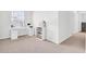 Bright bedroom featuring modern white desk, sleek shelving and neutral carpet at 202 N Light Way, Summerville, SC 29486