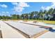 Community bocce ball court with picnic tables and lush green surroundings at 202 N Light Way, Summerville, SC 29486