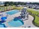 Resort-style community pool featuring lap lanes, splash pool, and a water slide tower at 202 N Light Way, Summerville, SC 29486