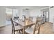 Bright dining area featuring a wooden table, seating for four, and access to a patio at 202 N Light Way, Summerville, SC 29486