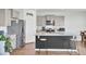 Kitchen features granite countertops, stainless steel appliances, a central island, and breakfast bar seating at 202 N Light Way, Summerville, SC 29486