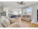 Open concept living space with modern furnishings, hardwood floors, and a view into the kitchen at 202 N Light Way, Summerville, SC 29486