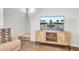 Cozy living room features stairs, a wooden media console, and a sofa at 202 N Light Way, Summerville, SC 29486