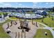 An aerial view of the community playground and pool area with a walking path at 202 N Light Way, Summerville, SC 29486