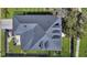 Aerial view of a home showing the roofline, patio, driveway, and manicured lawn at 2028 Ironstone Aly, Charleston, SC 29407