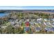An aerial view shows a neighborhood home near a marsh landscape with a distant bridge and waterway at 2028 Ironstone Aly, Charleston, SC 29407