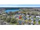An aerial view highlights a property in a neighborhood near a tranquil lake at 2028 Ironstone Aly, Charleston, SC 29407