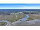 An aerial view of a marsh-front community showing the waterway, neighborhood, and surrounding landscape at 2028 Ironstone Aly, Charleston, SC 29407