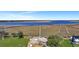 Aerial view showing partially built home, land, marshes, and the bay at 2028 Ironstone Aly, Charleston, SC 29407