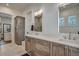 Bright bathroom featuring double vanity with wooden cabinets and modern fixtures at 2028 Ironstone Aly, Charleston, SC 29407