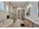 Luxurious bathroom with a soaking tub, walk-in shower, dual vanities, and modern finishes at 2028 Ironstone Aly, Charleston, SC 29407