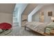 Inviting bedroom features a cozy daybed nestled under a window and unique architecture, creating a snug and stylish retreat at 2028 Ironstone Aly, Charleston, SC 29407